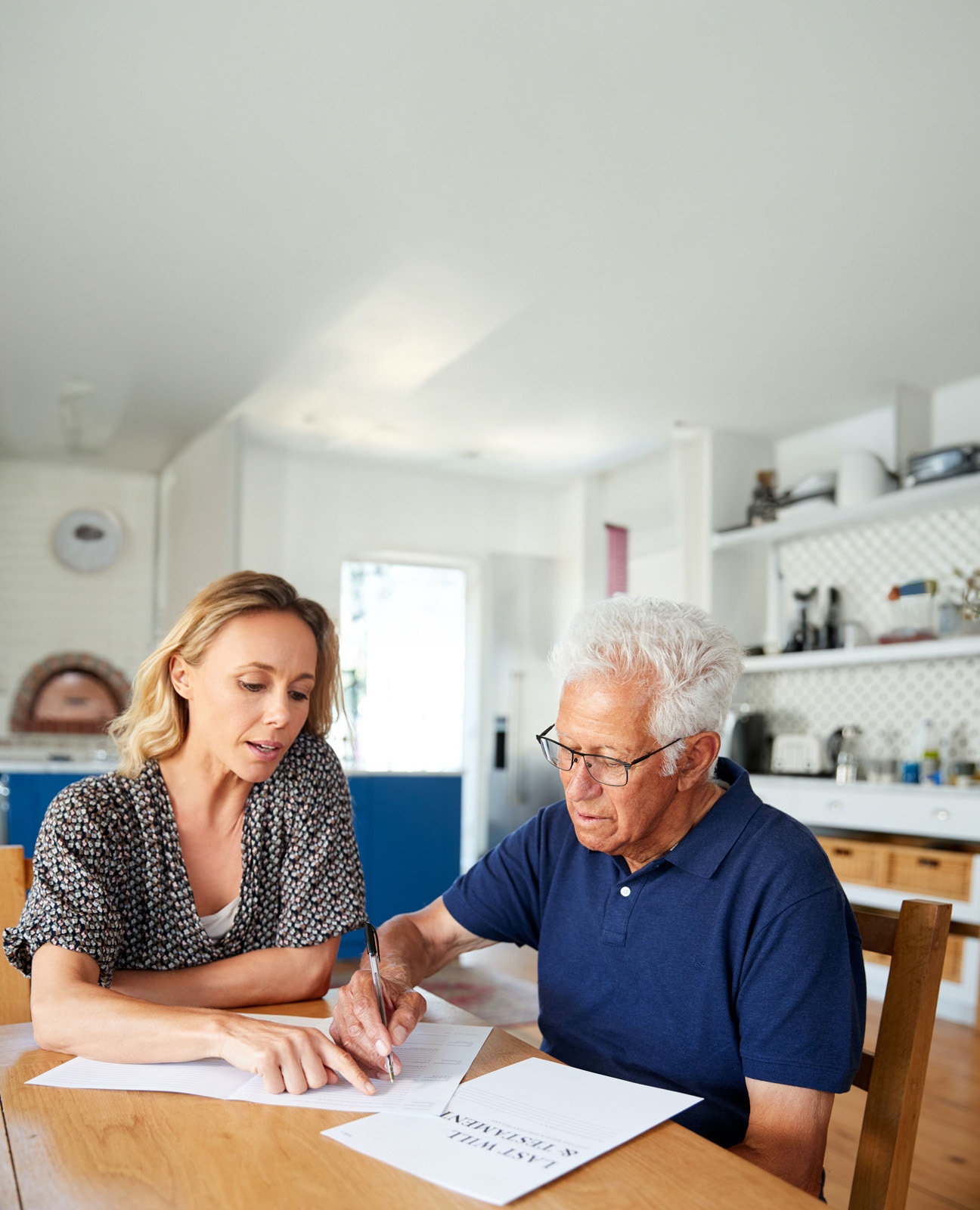 A father and daughter look over a Will and set up My Excutry Box