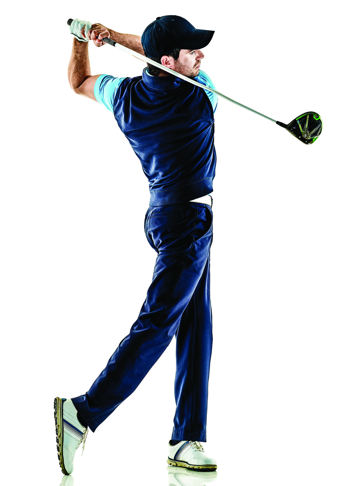 A golfer pictured mid swing