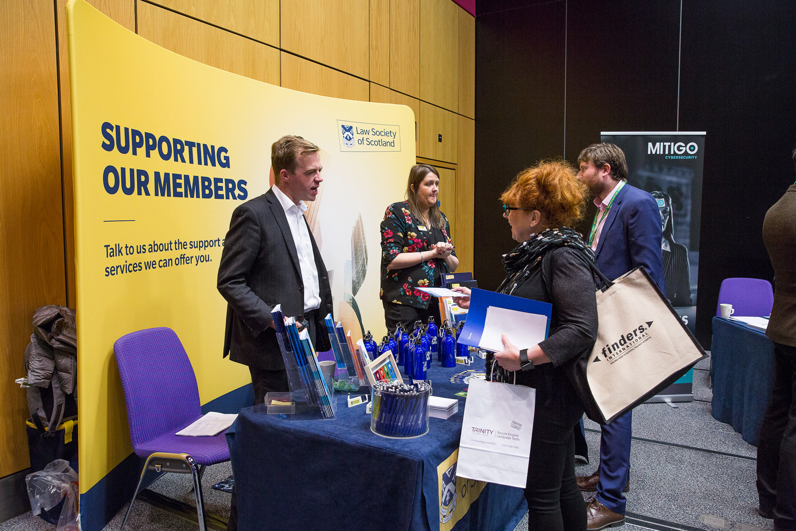 Members of the Society team talk to delegates at the conference